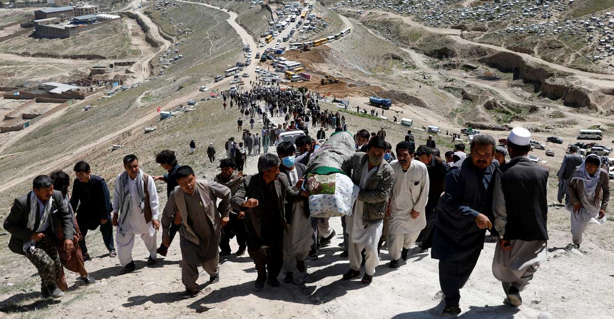 Kabul Men carry the coffin of a victim of yesterday's explosion during a mass funeral ceremony in Kabul, Afghanistan May 9, 2021. Reuters