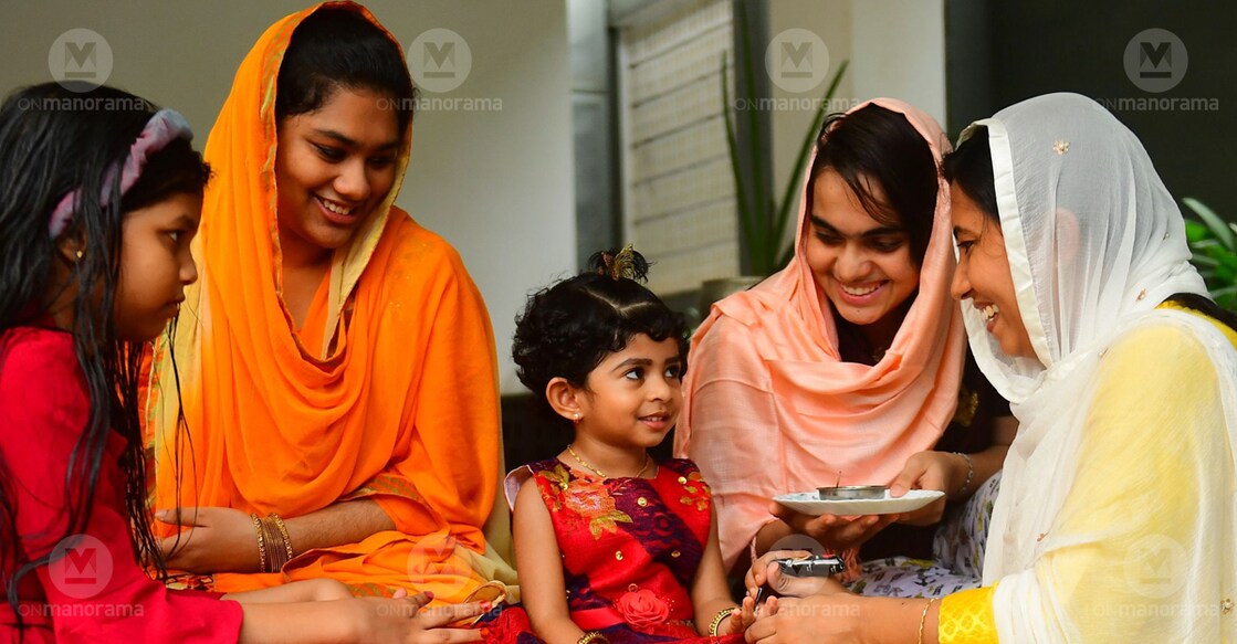 Elders apply mehendi on children ahead of the Eid celebrations on Thursday. Photo: Russel Shahul