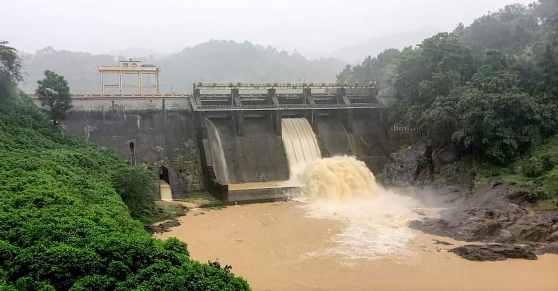 The shutters of the Kallarkutty dam opened due to the rising water level during heavy rain in Idukki, Saturday, May 15, 2021. Photo: PTI
