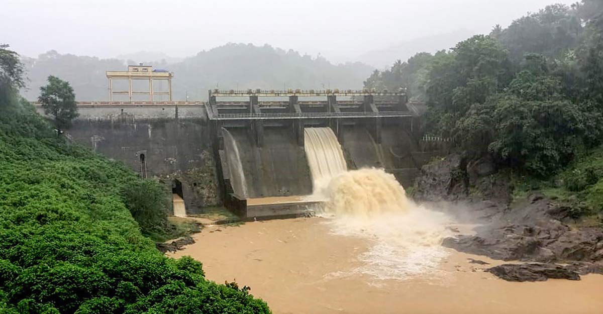 The shutters of the Kallarkutty dam opened due to the rising water level during heavy rain in Idukki, Saturday, May 15, 2021. Photo: PTI