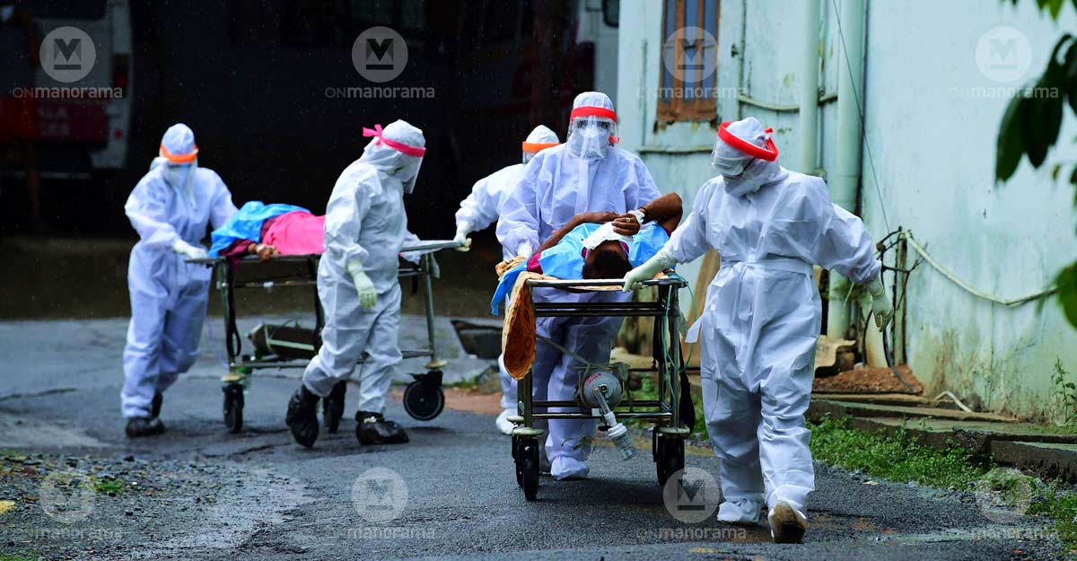 Health staff shifting COVID patients. File photo