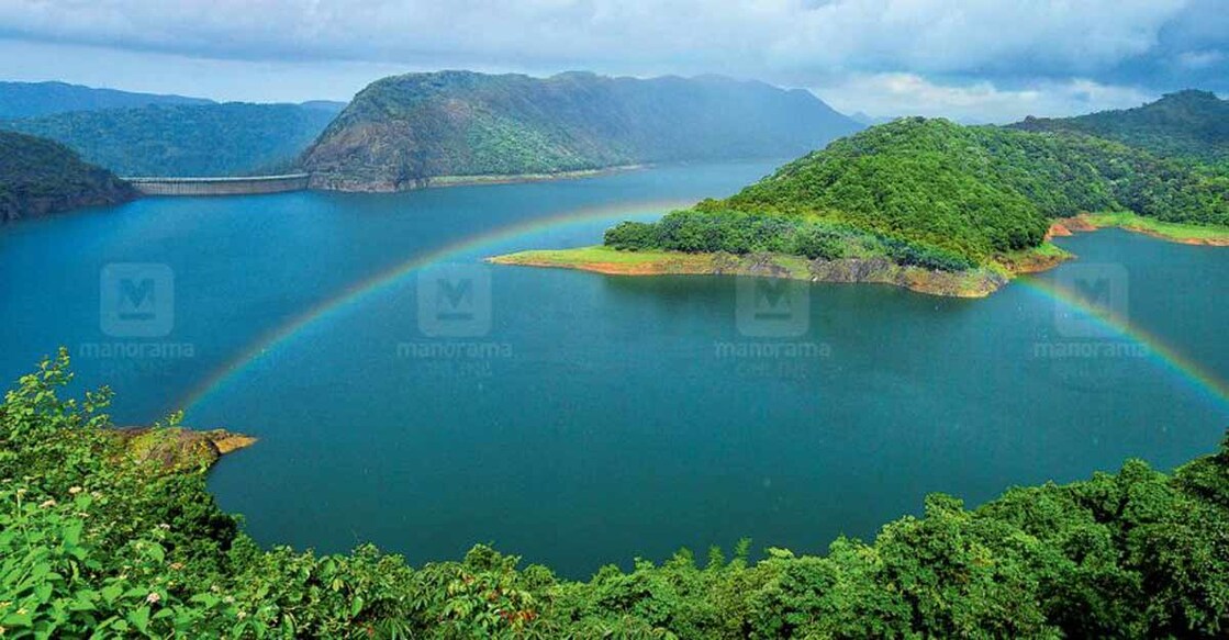A rainbow forms near the Idukki arch dam reservoir. Photo: Reju Arnold