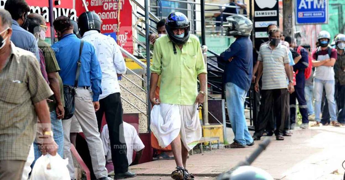 People queue up outside a Bevco outlet in Thiruvananthapuram. 