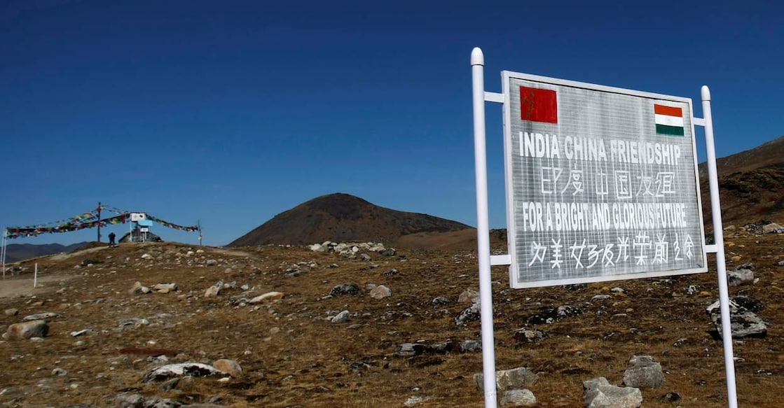 INDIA-CHINA/BORDER A signboard is seen from the Indian side of the Indo-China border at Bumla, in the northeastern Indian state of Arunachal Pradesh. REUTERS/Adnan Abidi/File Photo