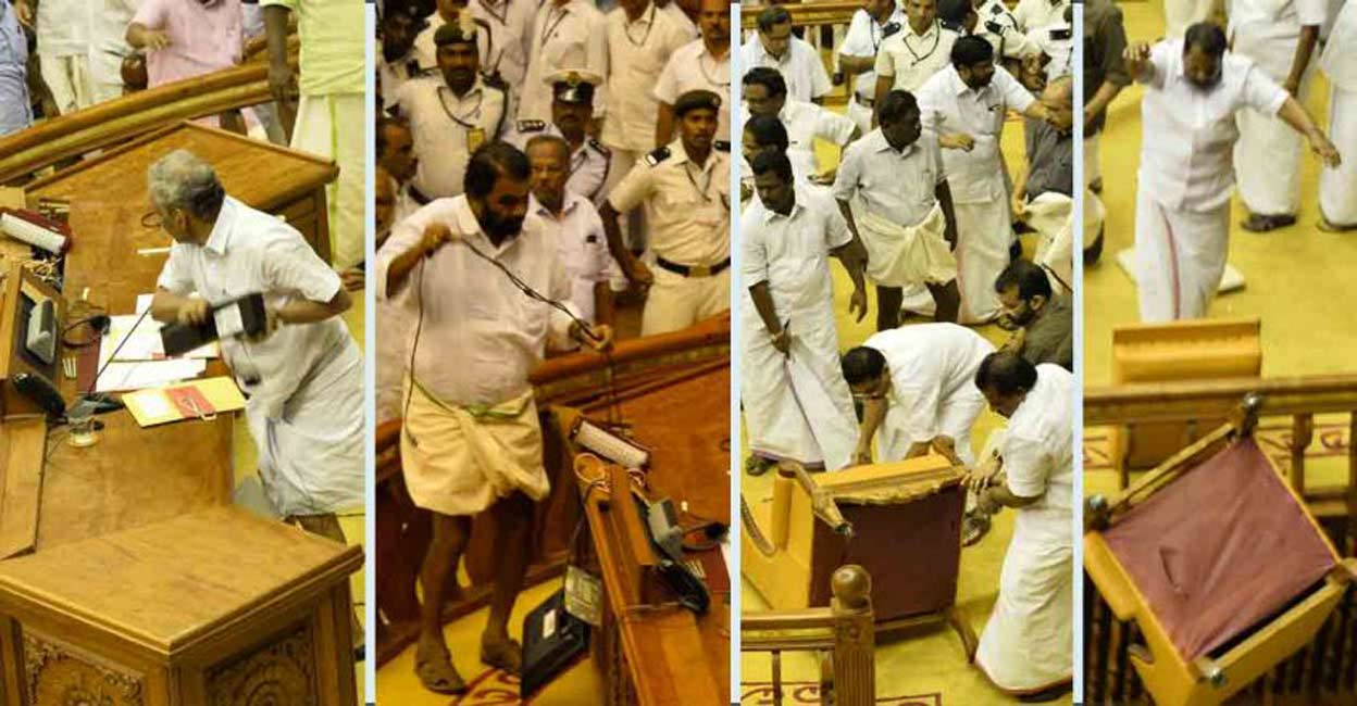 V Sivankutty standing atop a table during the ruckus in the Legislative Assembly in 2015 during KM Mani's Budget presentation.