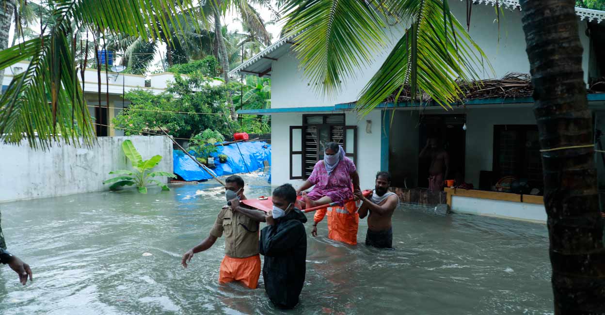 chellanam-flood-rescue A woman being rescued during the floods in Chellanam in May, 2021. Photo: Special Arrangement