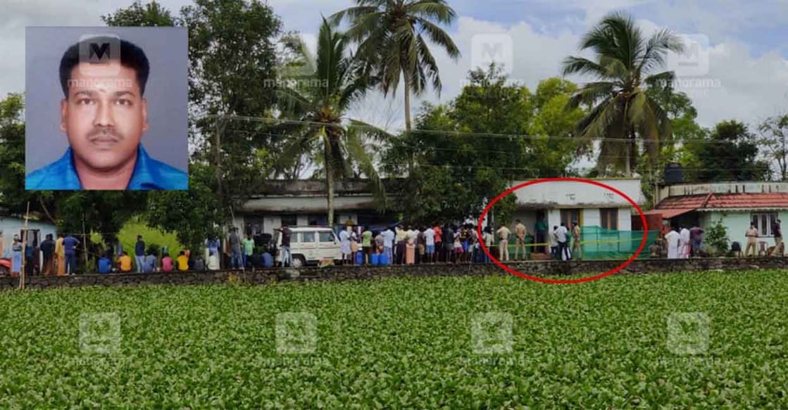 Locals gather as police inspect the house where the body was buried (in red circle). Photo: Rijo Joseph/Manorama