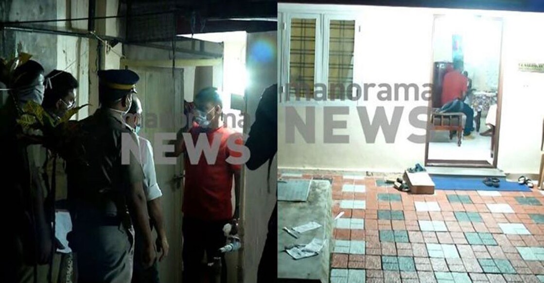 Police at the crime scene at Girinagar, Kadavanthara. 