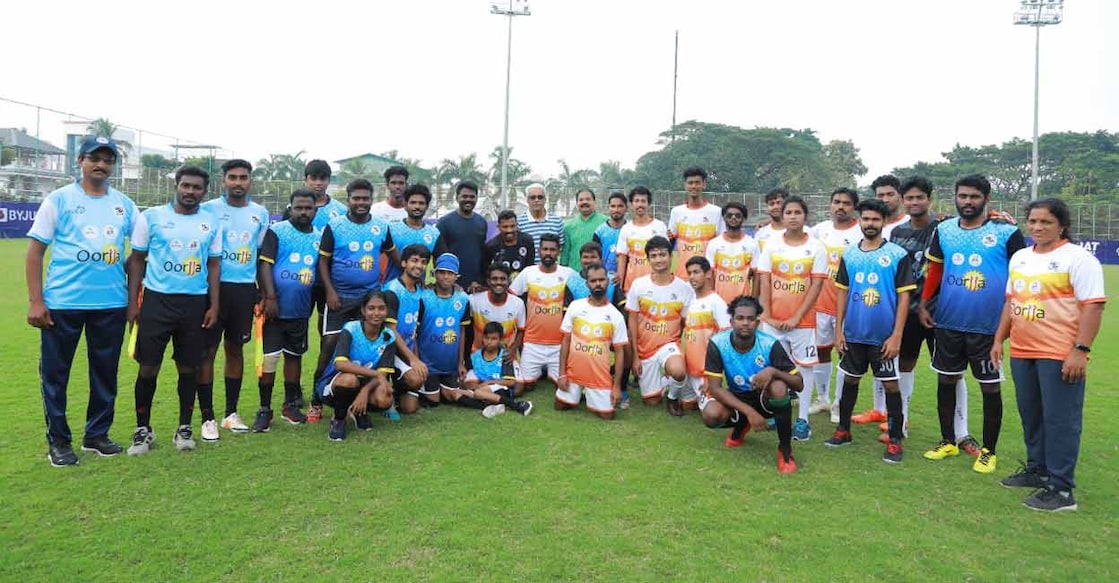 oorjja-football M Sivasankar and P V Sreenijin MLA with the teams which took part in the inclusive football match. Photo: Special arrangement