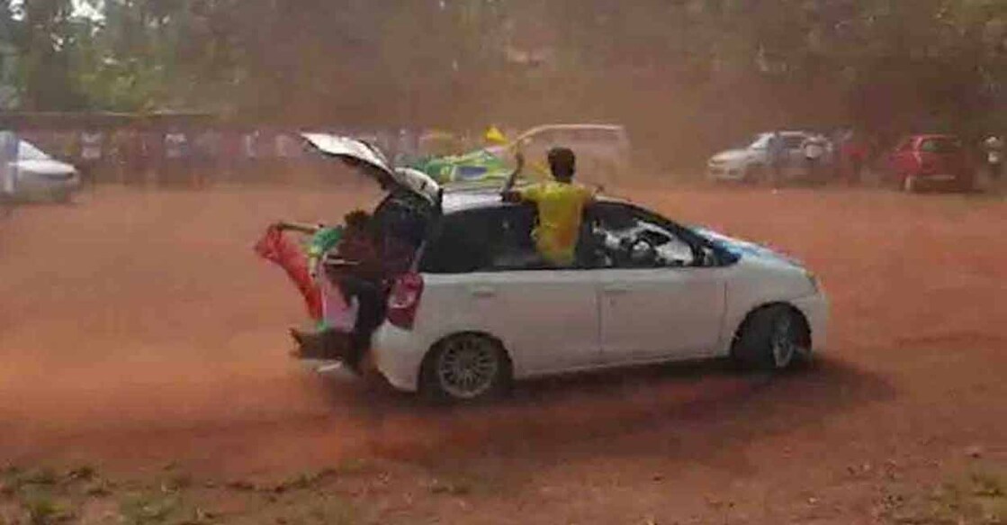 Youngsters performing stunts on cars with doors kept open at Karanthur in Kozhikode on Wednesday.