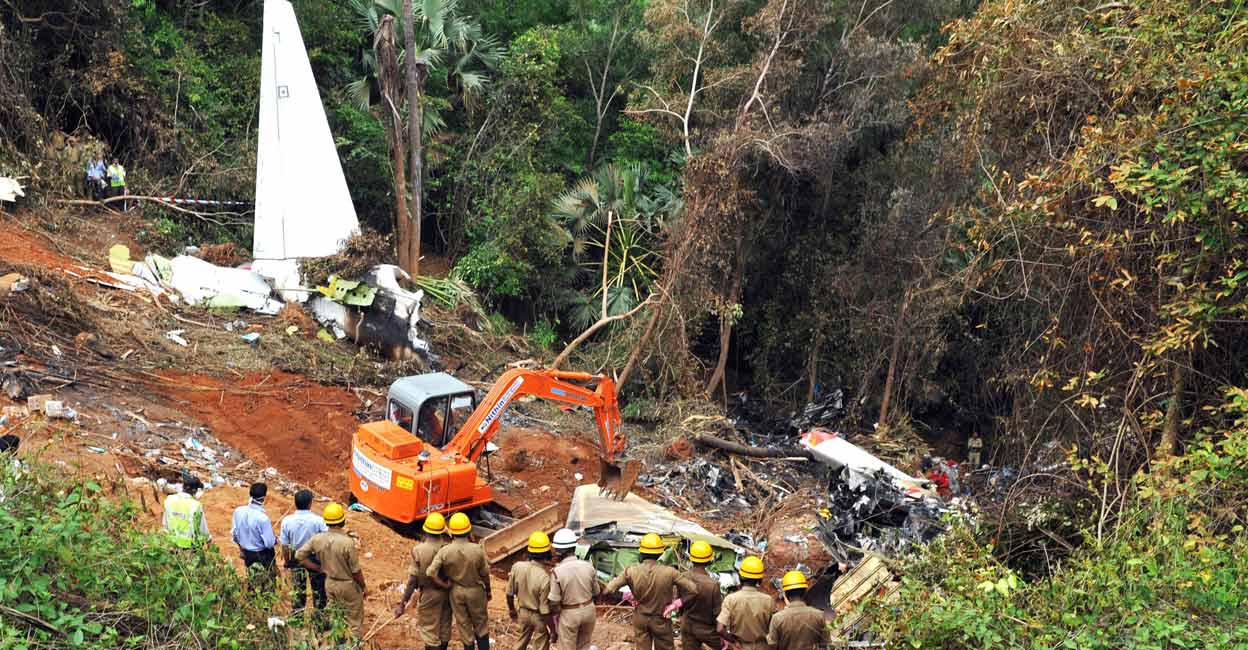 Firemen inspect the crash site of Mangaluru Air India Express on May 22, 2010. File photo: AFP