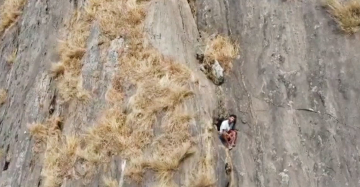 Kerala youth trapped in Palakkad hill cleft Drone visual of R Babu, a 23-year-old from Cheradu, Malampuzha, who had slipped and fell into a hill cleft in Palakkad's Malampuzha.