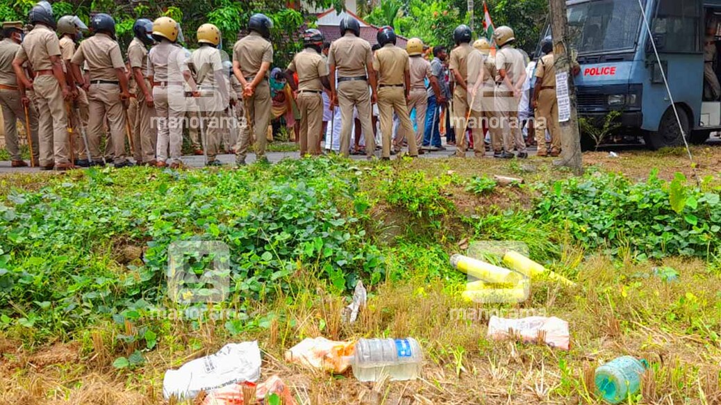 Police officers stand guard for the survey team in Chottanikkara. Photo: Manorama