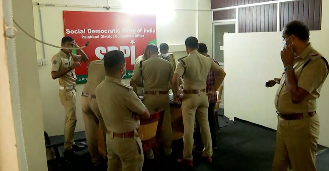 Police raiding the district committee office of the SDPI.