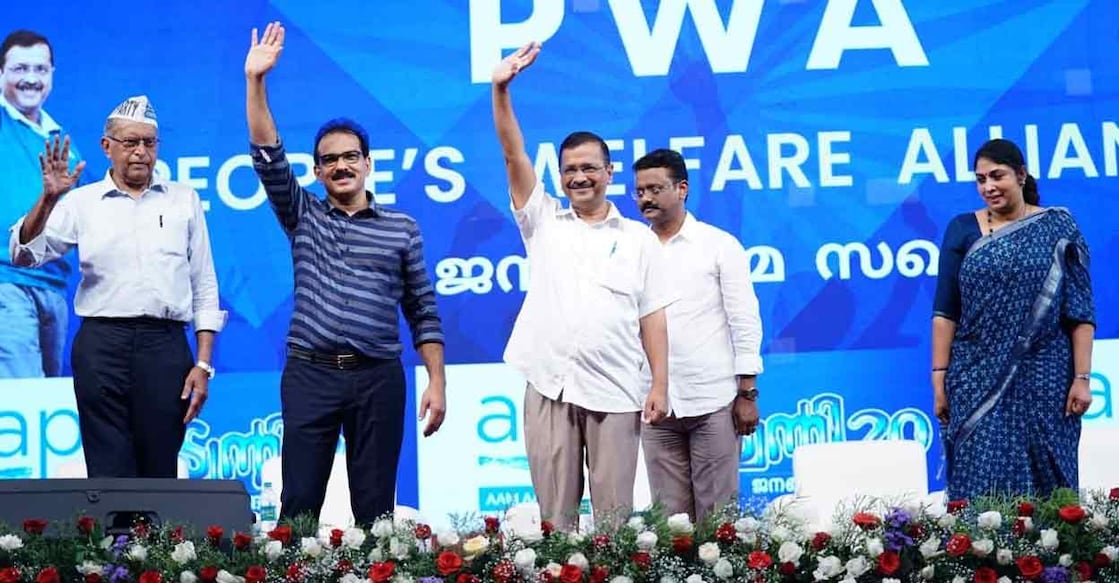 Delhi CM Arvind Kejriwal with Twenty20 chief coordinator Sabu M Jacob at Kizhakkambalam in Ernakulam on Sunday. Photo: Facebook/ @AAPKerala 