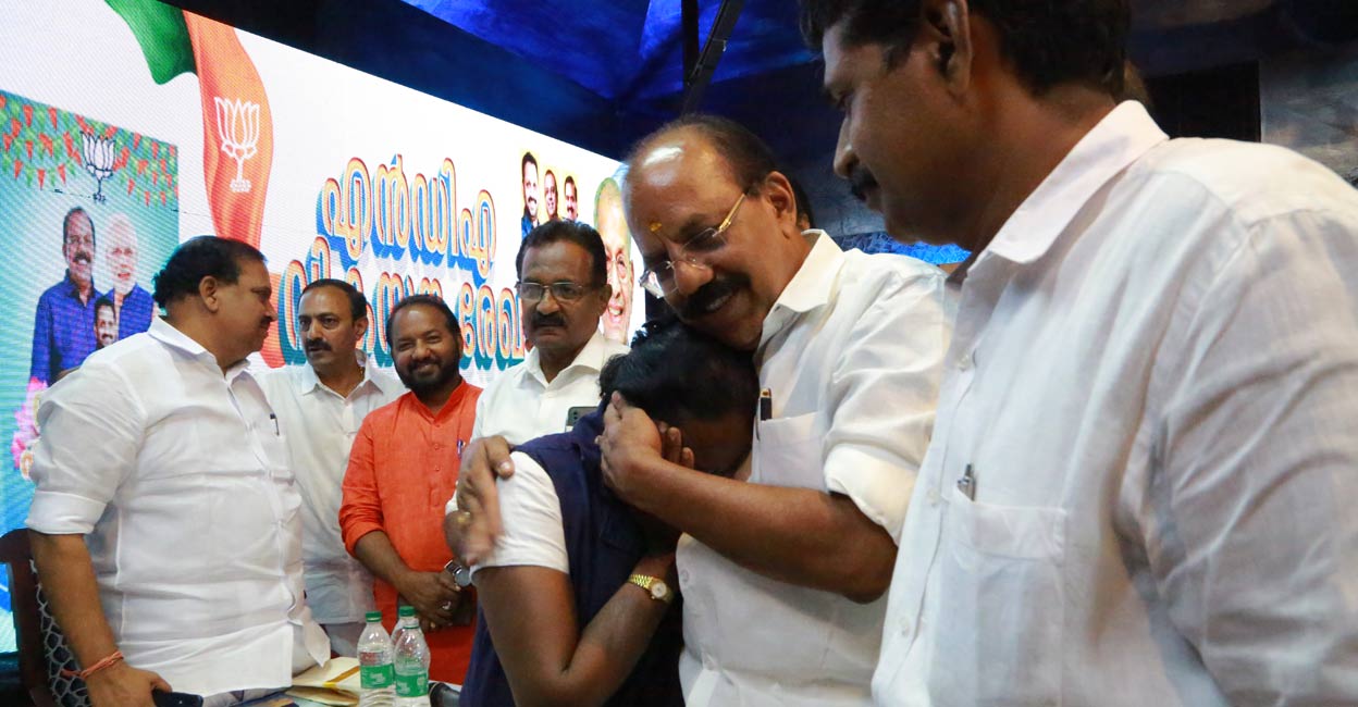 anr-thankamani Thankamani embraces BJP candidate A N Radhakrishnan after party state chief K Surendran announced the decision to build a house for her. Photo: Special arrangement