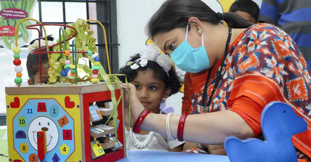 Union Minister for Women and Child Development Smriti Irani interacts with a child during her visit to Varadoor Anganwadi Center, in Wayanad on Tuesday. PTI 