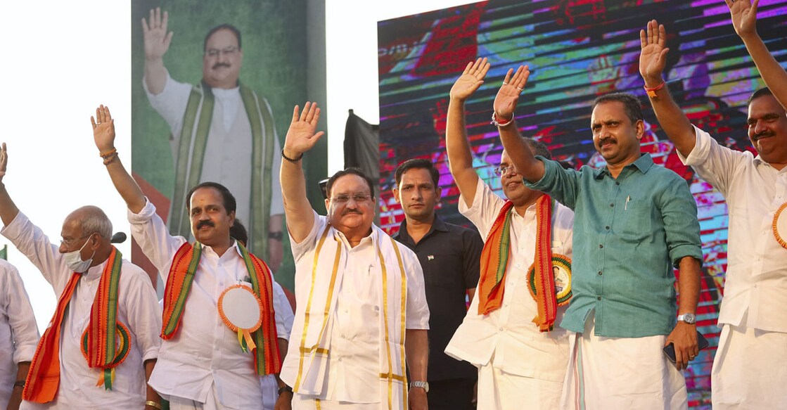 BJP national president J P Nadda with party leaders waves at his supporters during a public rally, in Kozhikode, Friday, May 6, 2022. Photo: PTI