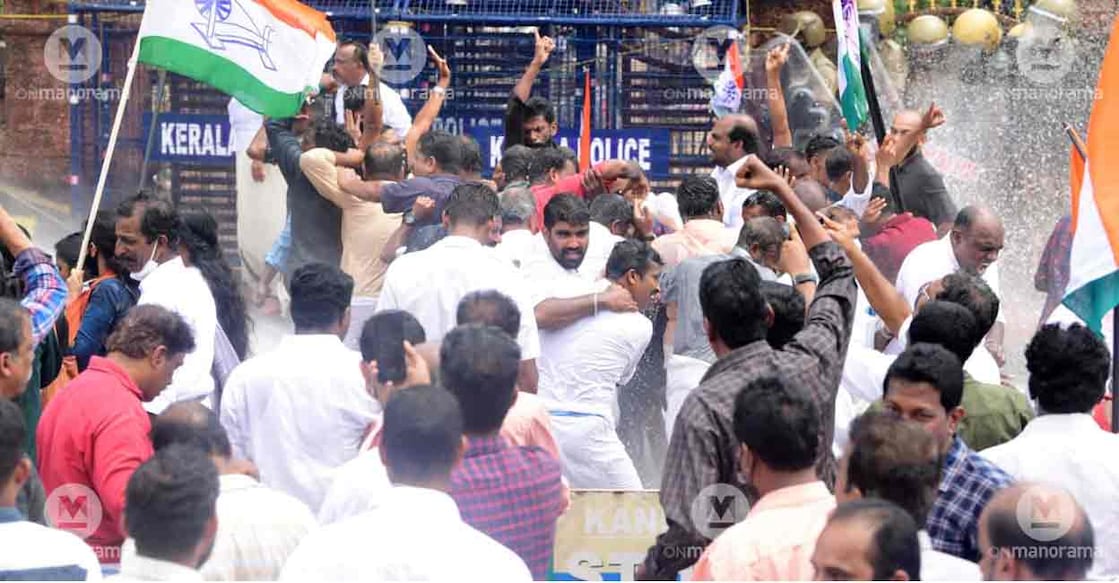 Cops try to disperse Congress activists during a protest march in Kannur. Photo: Harilal/Manorama
