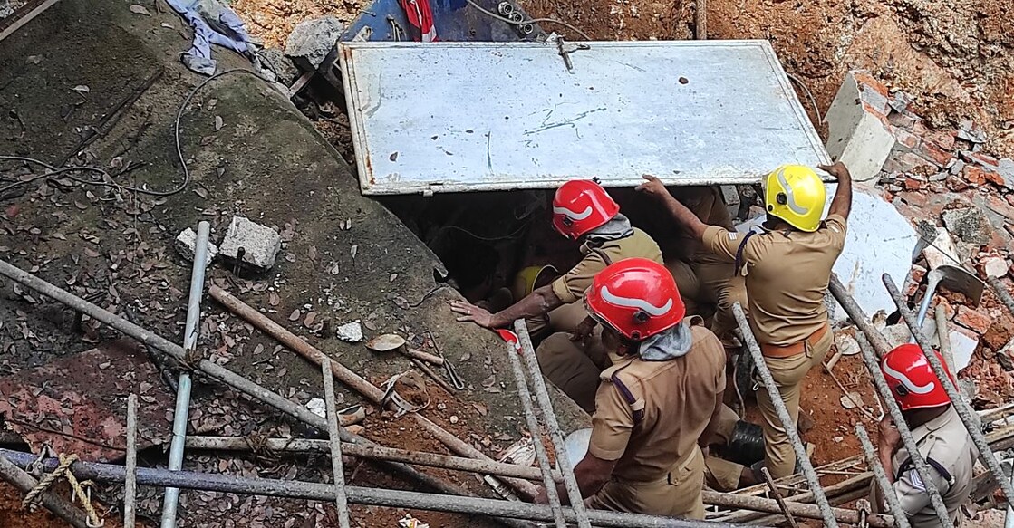 Accident Fire force officials at work to rescue the guest workers trapped in the landslide. Photo: MMTV