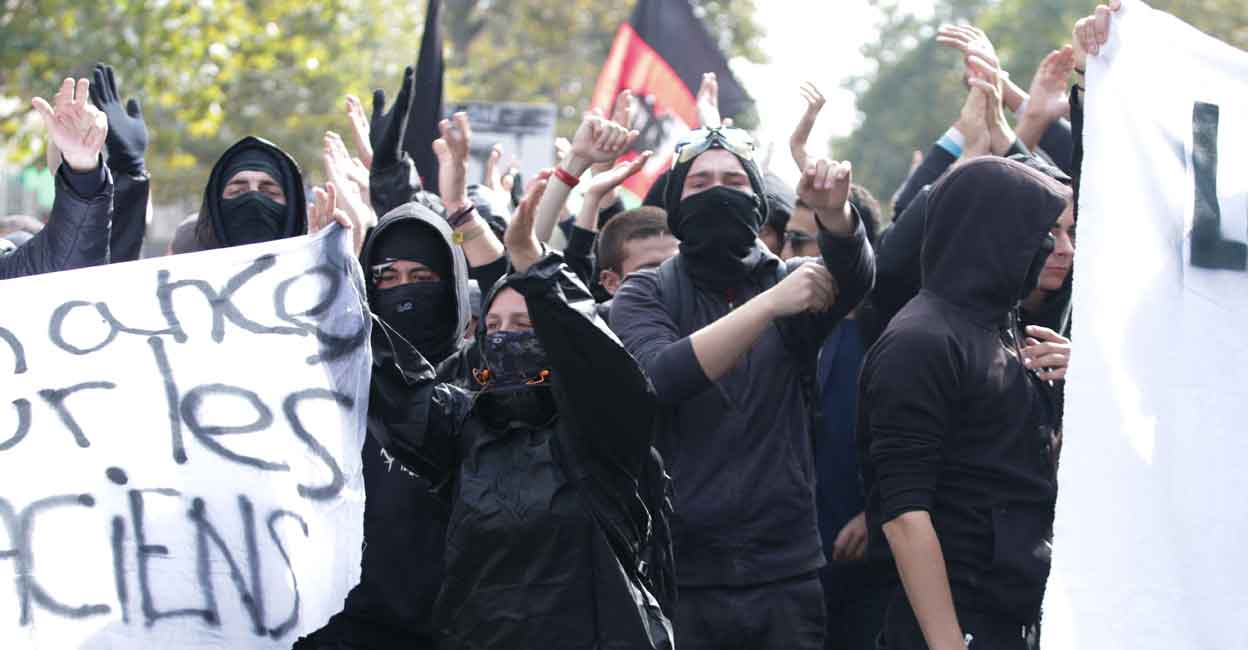Members of the Black Bloc anarchist group demonstrate over the French government's labour reforms on September 23, 2017 in Paris. Photo: AFP Members of the Black Bloc anarchist group demonstrate over the French government's labour reforms on September 23, 2017 in Paris. Photo: AFP