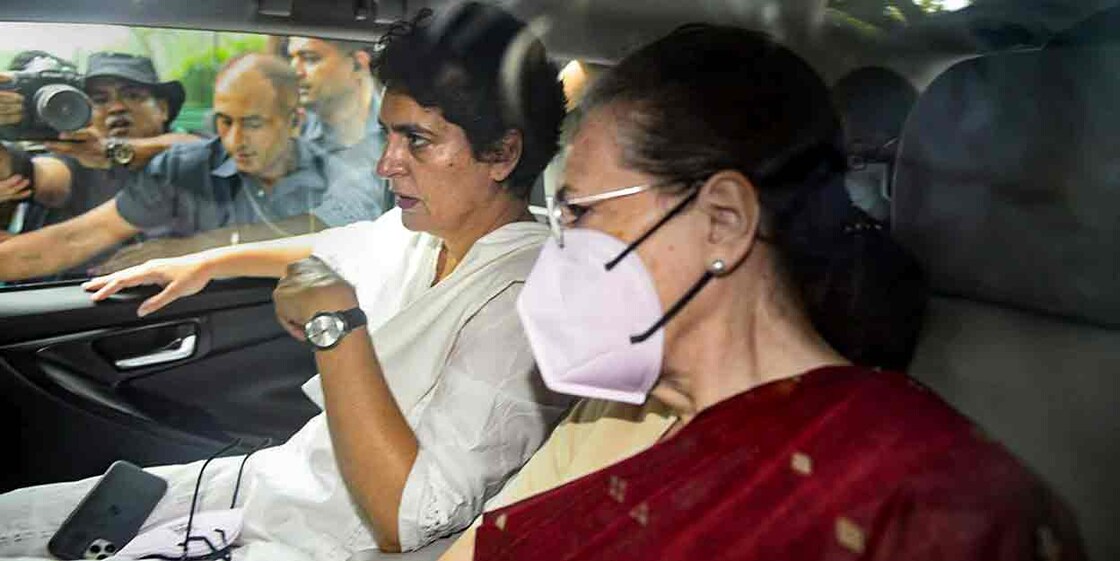 Congress President Sonia Gandhi with party General Secretary Priyanka Gandhi Vadra leaves from her residence ahead of appearing before the Enforcement Directorate in connection with the National Herald case, in New Delhi, Thursday, July 21, 2022. (PTI Photo)