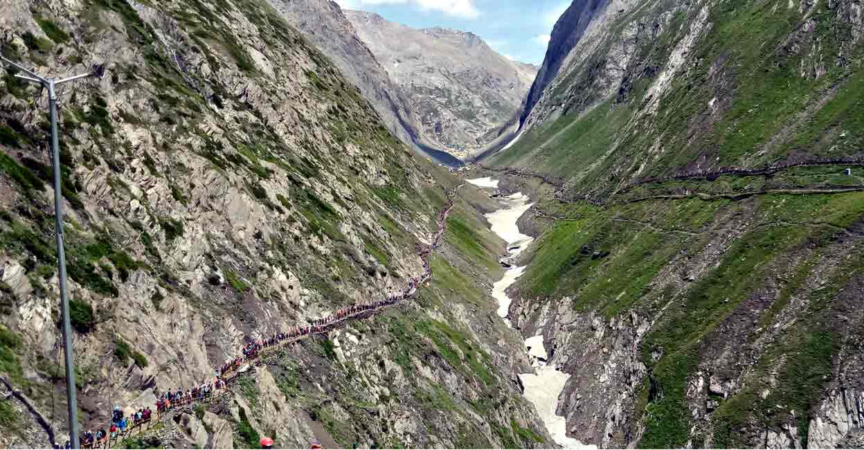 PTI07_08_2022_000304B Pilgrims on their way to the holy cave shrine of Amarnath, Friday, July 8, 2022. Photo: PTI