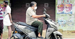 Now, Saji Cheriyan booked for riding a scooter without helmet