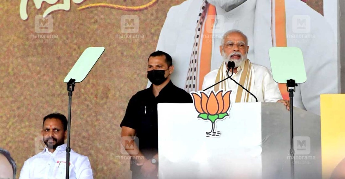 Prime Minister Narendra Modi addressing the crowd during a meeting of the BJP in Kochi on Thursday. BJP state president K Surendran can also be seen. PHOTO: Manorama