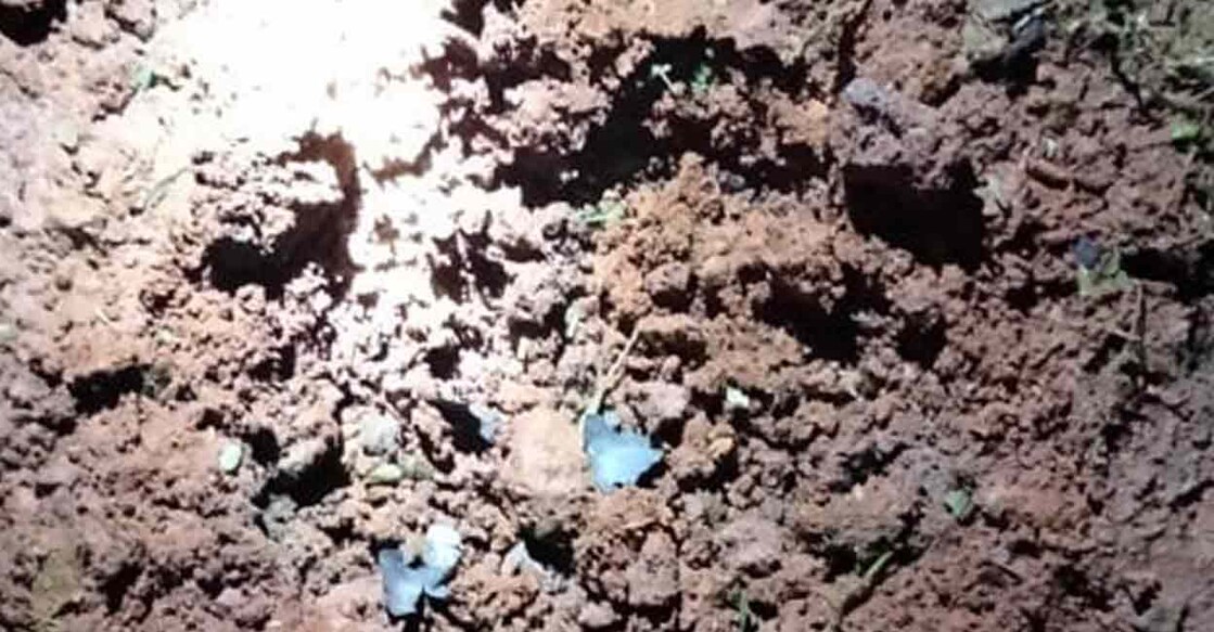 bomb-calicut The crater that was created by a steel bomb, which was hurled by unknown persons, at OP Mukku in Valayam, Kozhikode. Photo: Manorama