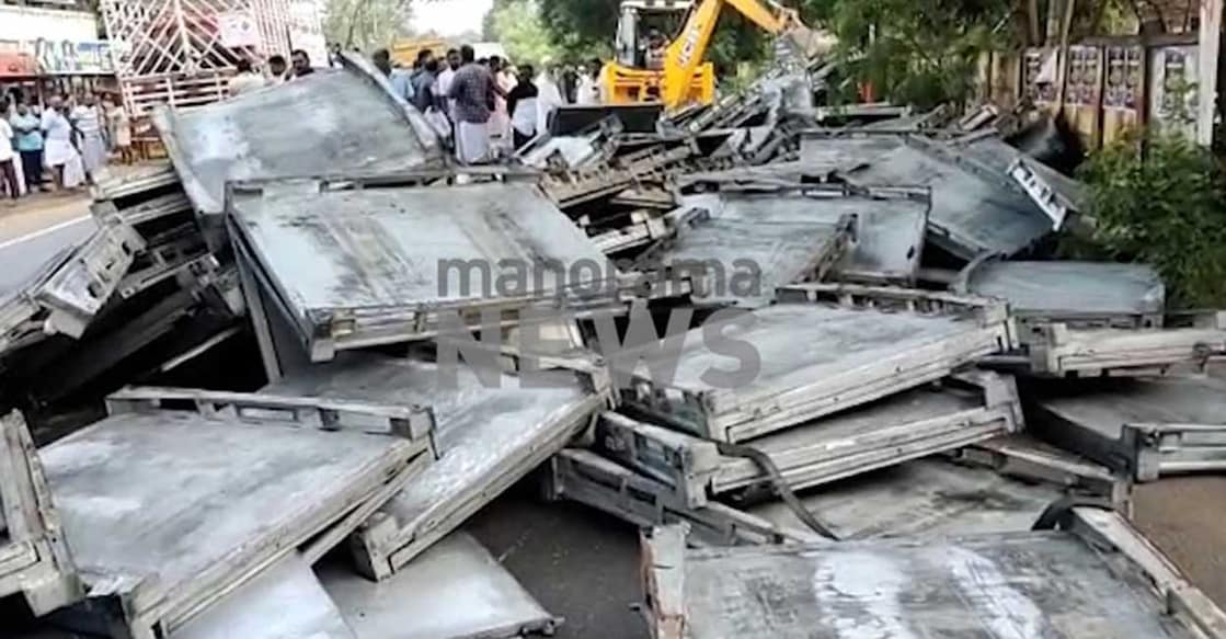 Iron sheet falls off lorry Thrissur | Photo: Manorama News The iron sheets that fell onto the road from the lorry. Photo: Manorama News