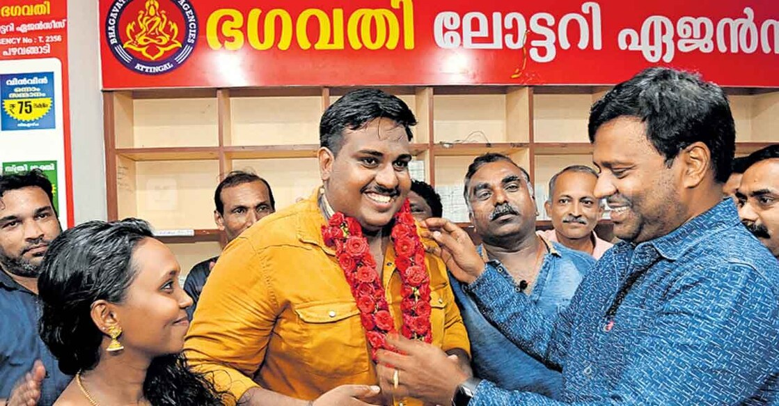 Anoop and his wife, winners of the Onam Bumper lottery 2022