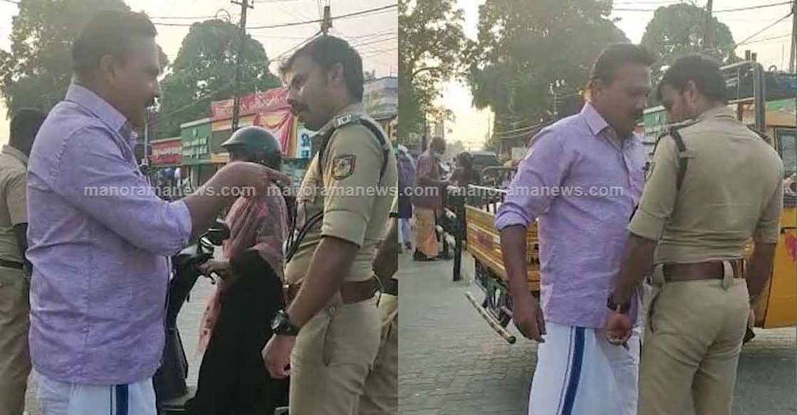 kayamkulam-si-threat A local CPM leader, Ashkar Nampalasheril is confronting SI Sreekumar at Kayakulam. Photo: Screengrab from Manorama News