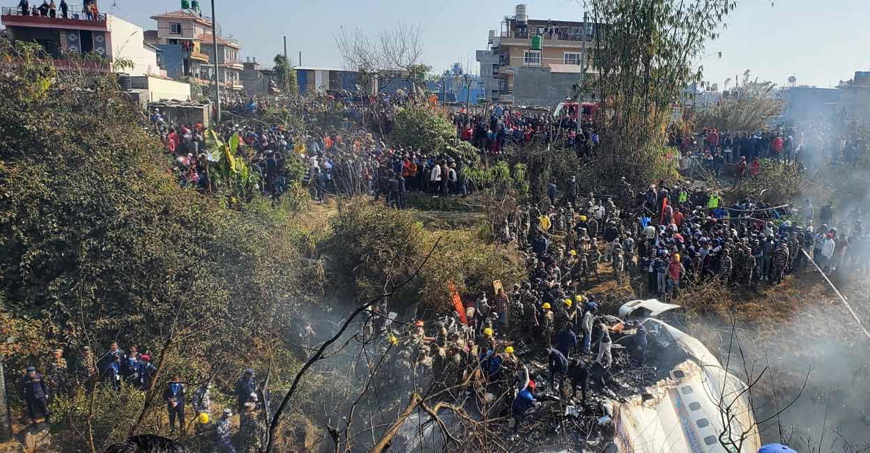 A general view of people gathered after the plane crash in Pokhara, Nepal on Sunday. Photo: Reuters/ Naresh Giri