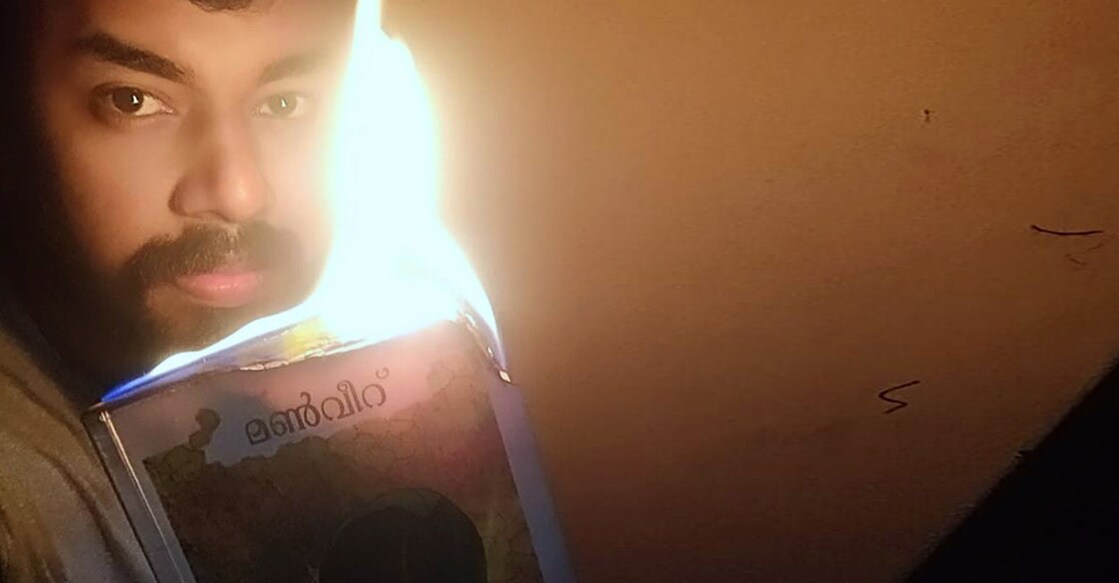 The New Year Day's solo protest went viral when he made the burning book his profile picture on Facebook and tagged Veerankutty: Special Arrangement