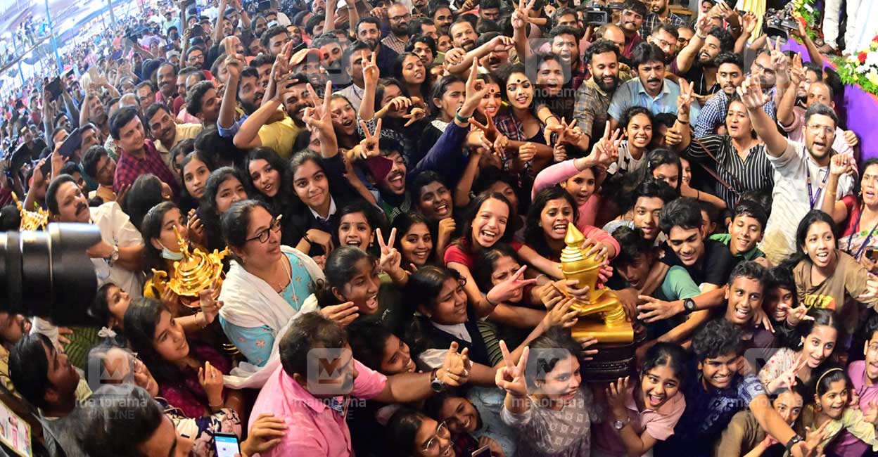 Participants from Kozhikode district with the 61st Kerala State School Kalolsavam overall championship trophy. Photo: Rinkuraj Mattancheriyil/Manorama