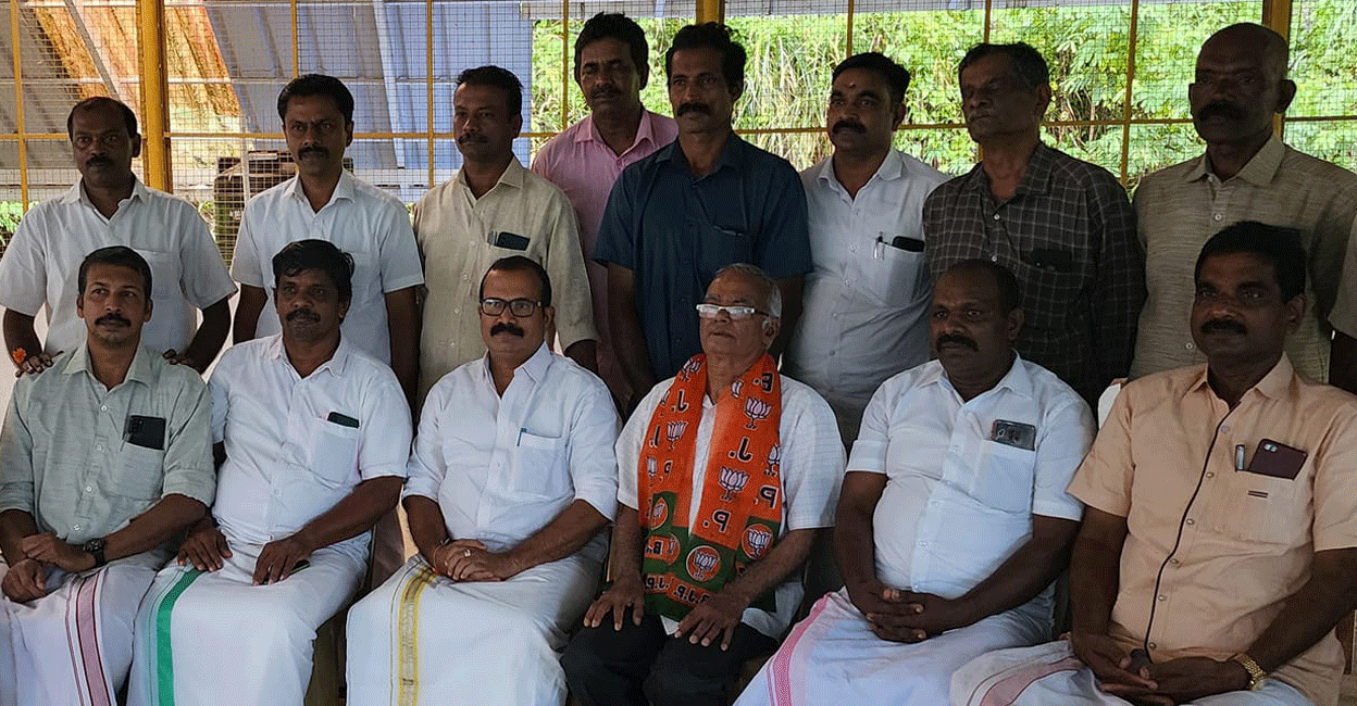 Fr Kuriakose Mattam (saffron shawl) poses with BJP members in Idukki on Monday. Photo: Facebook/KS Aji