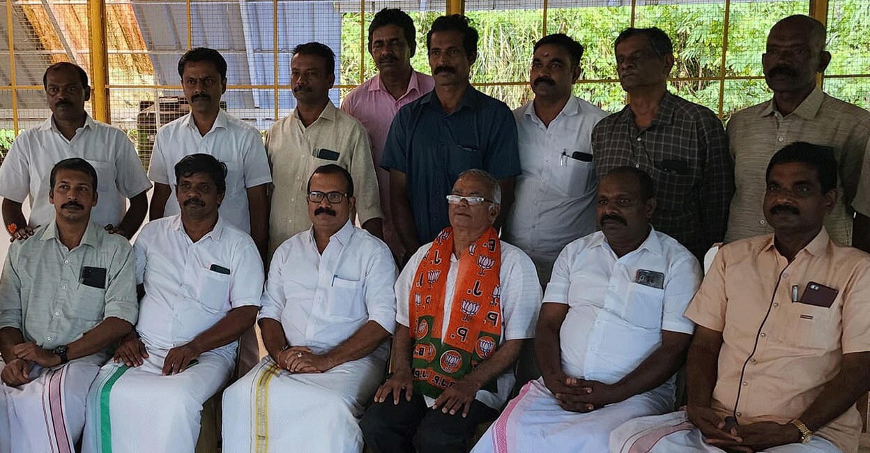 Fr Kuriakose Mattam (saffron shawl) poses with BJP members in Idukki on Monday. Photo: Facebook/KS Aji