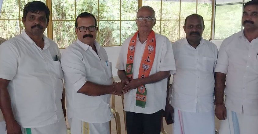 Fr Kuriakose Mattam is welcomed by KS Aji, president of BJP's Idukki district unit. Photo: Manorama News