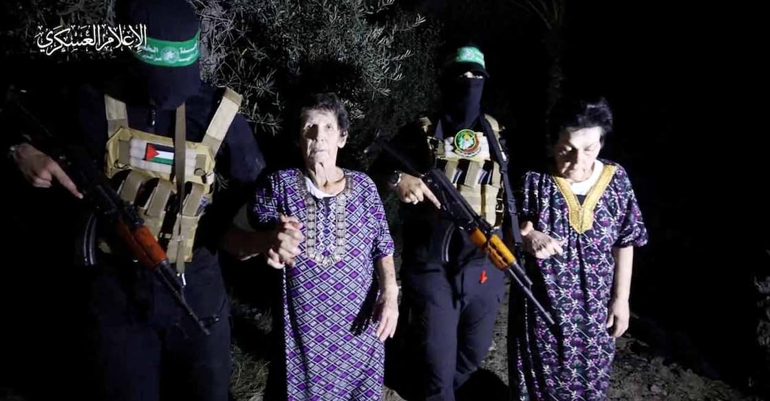 ISRAEL-PALESTINIANS-HOSTAGES Yocheved Lifshitz and Nurit Cooper (also known as Nurit Yitzhak) who were held hostages by Palestinian Hamas militants, are released by the militants, in this video screengrab obtained by Reuters on October 23, 2023. Photo: Al-Qassam Brigades, military wing of Hamas/Handout via REUTERS