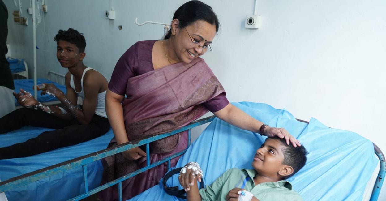 veena-george-kalamassery Health Minister Veena George comforts a child during her visit to Kalamassery Medical College. Photo: Special Arrangement