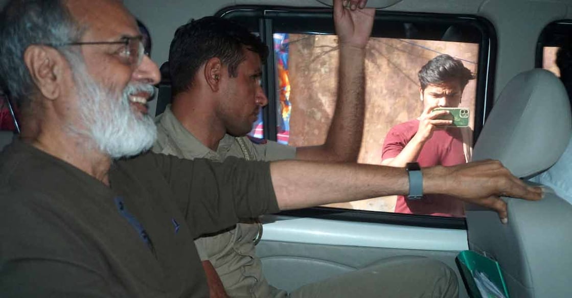 Founder and Editor-in-Chief of NewsClick Prabir Purkayastha is brought to Delhi Police Special Cell in New Delhi, India, Tuesday, Oct. 3, 2023.  Photo: AP/Dinesh Joshi