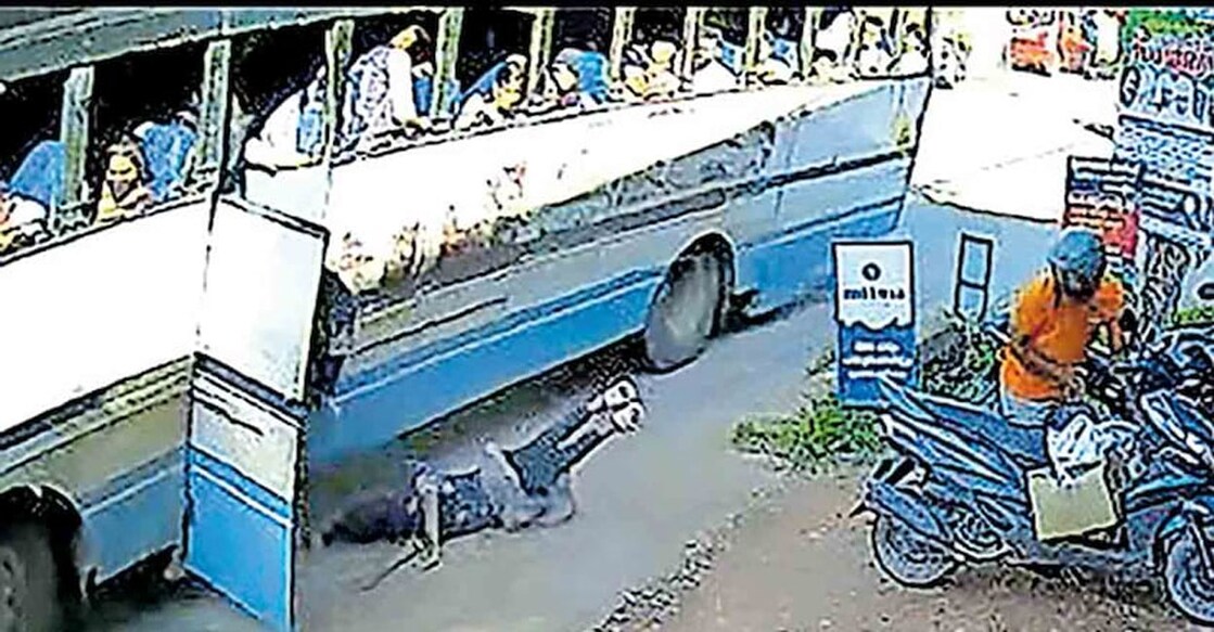 Fathima, a Class 9 student of Karur Lakshmi Vilasam High School, had a miraculous escape as the back wheel of the bus was only just inches away from her. Photo: Manorama