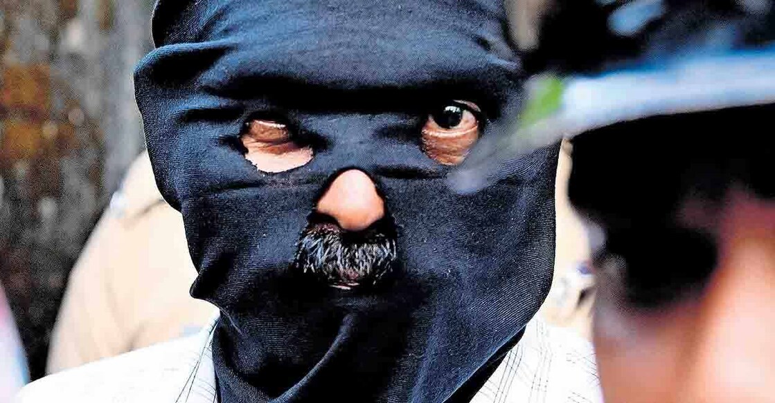 Dominic Martin during evidence collection at his flat in Athani. Photo: Manorama