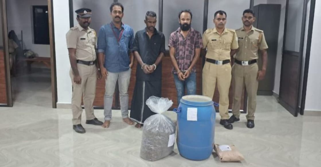 wayanad-drug-racket The Excise team with the accused TS Suresh (black shirt) and Jamsheer Ali and the seized ganja. Photo: Special Arrangement