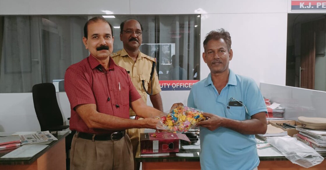 mazon-sweets-abigel PP Ganesan, a mason from Kozhikode presents sweets to the city police control room. Photo: Special arrangements