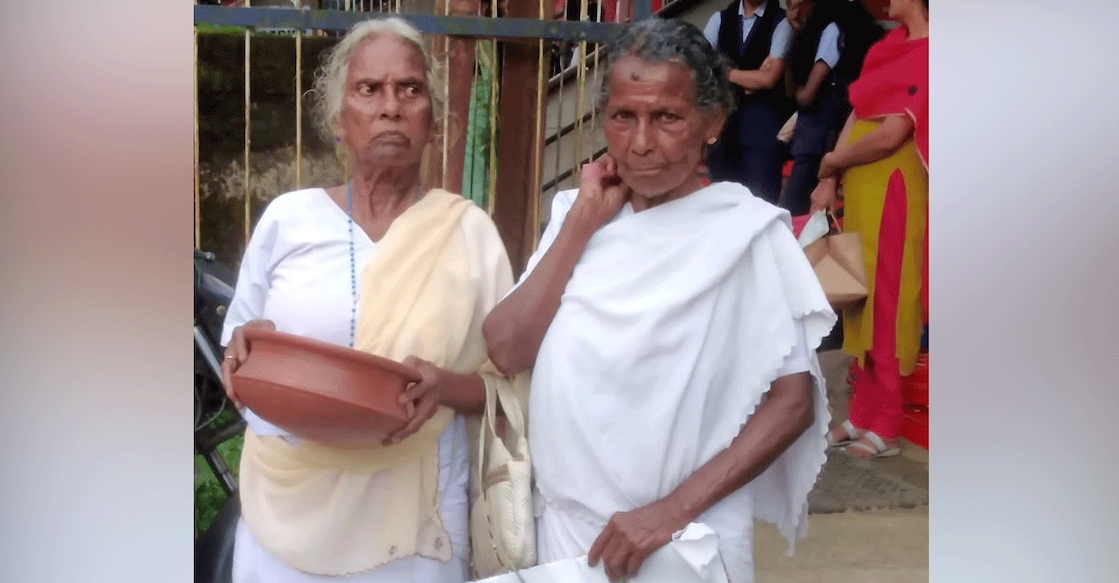 adimaly-elderly-protest-annamma-mariyakutty Mariyakutty (left) and Annamma Ouseph seek money from the public in Adimaly Town on Wednesday. Photo: Special arrangement