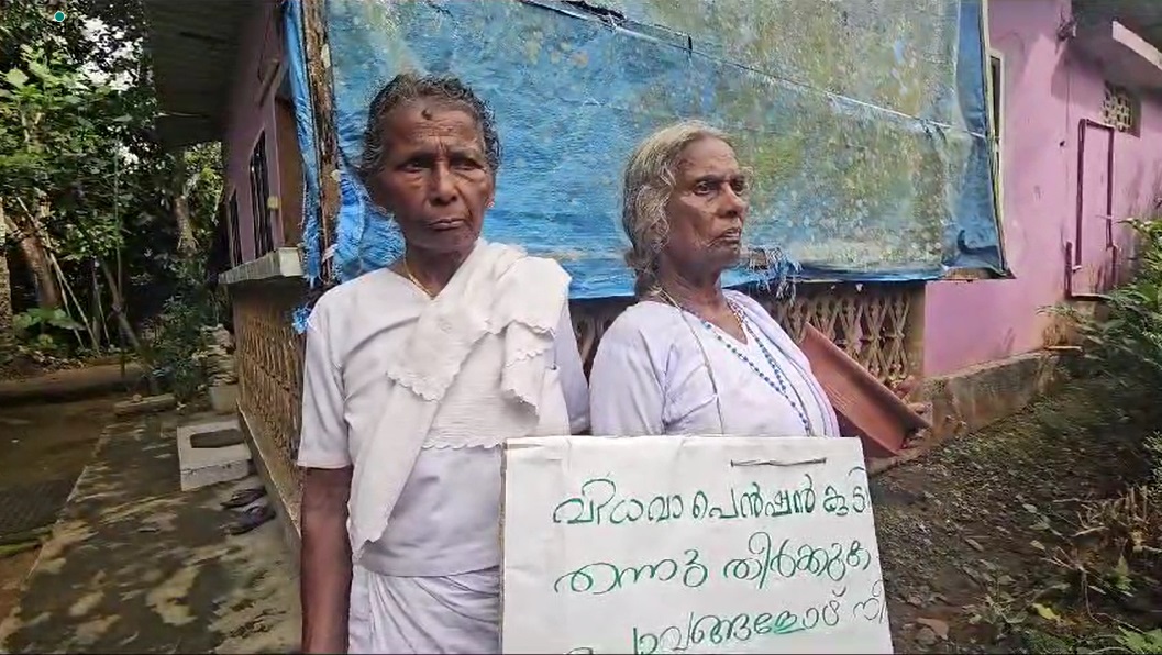 Mariyakutty and Annamma Ouseph have been carrying a handwritten placard explaining their plight. Photo: Special arrangement