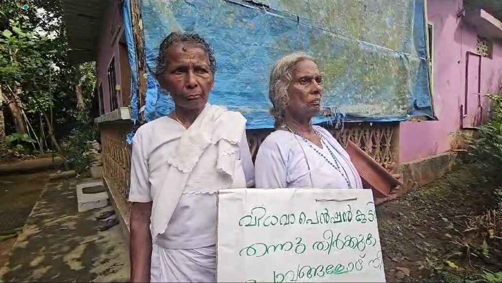 Mariyakutty and Annamma Ouseph have been carrying a handwritten placard explaining their plight. Photo: Special arrangement