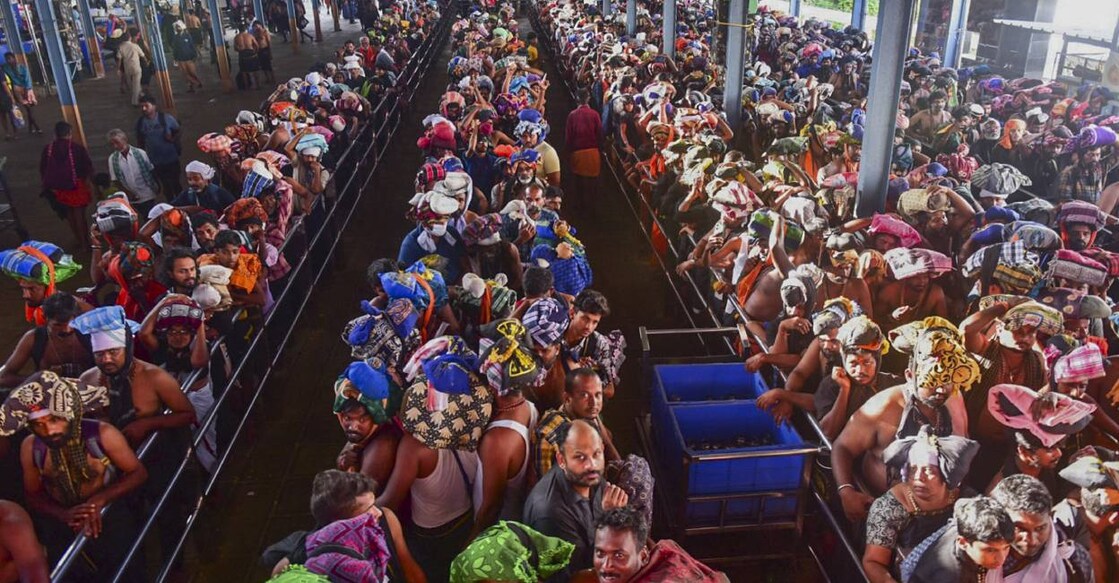 Pilgrims line up to have darshan at Sabarimala temple. Photo: PTI